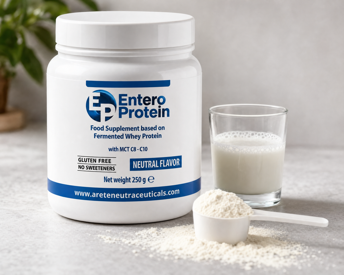 Enteroprotein accanto a un bicchiere di latte e al misurino
